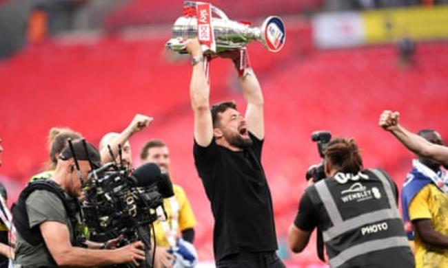 Russell Martin lifts the trophy after Southampton's promotion
